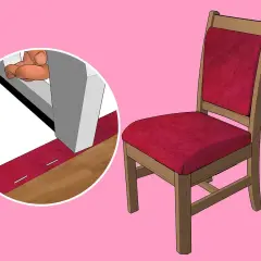 Dettaglio su come imbottire una sedia di legno con tessuto rosso, fissato con graffette.
