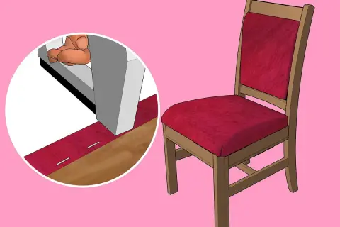 Dettaglio su come imbottire una sedia di legno con tessuto rosso, fissato con graffette.