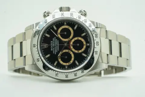 Rolex Daytona watch with black dial and tachymeter bezel.