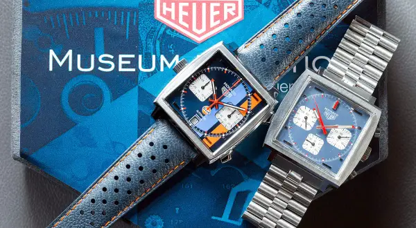 Due orologi Heuer Monaco, uno con quadrante blu e arancione Gulf, l'altro blu, ricordano lo stile di Steve McQueen.