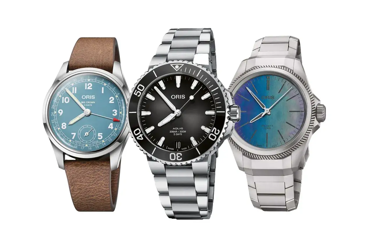 Tre orologi Oris: un Big Crown azzurro con cinturino in pelle, un Aquis nero sportivo e un modello con quadrante cangiante. Ottime opinioni per questi orologi.