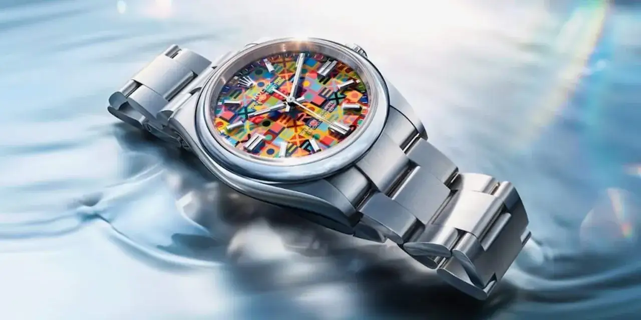 Orologio Rolex Oyster Perpetual con quadrante colorato e geometrico, un'esplosione di gioia che cattura il significato di un'icona senza tempo.