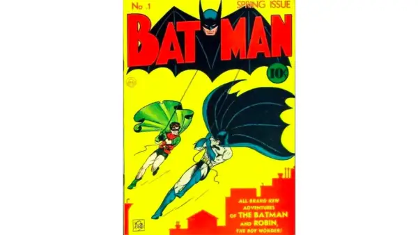 Copertina di Batman N.1, uno dei fumetti più costosi, con Batman e Robin che planano su Gotham City.